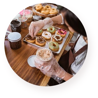The girl prepares the most delicious donuts